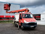 a red truck that is parked in front of a building