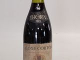 a bottle of wine that is sitting on a table
