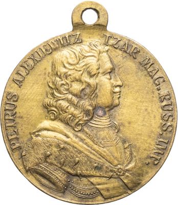 une image représentant une médaille d'or sur laquelle figure le portrait d'un homme