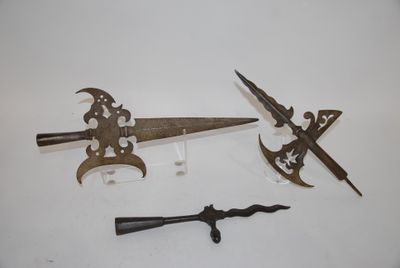 several different types of weapons are displayed on a white surface