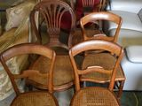 four chairs that are sitting next to each other in a room