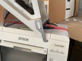 a white microwave sitting on top of a pile of boxes