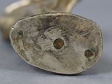 a close up of a silver object on a table