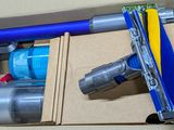 a box with a vacuum and other items in it