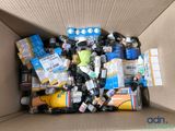a cardboard box filled with assorted items in it