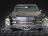 a old car that is sitting on a checkered floor