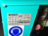 a close up of a blue parking meter with a sticker on it