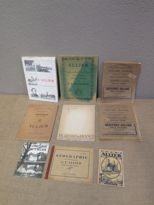 several books are sitting on a table next to each other