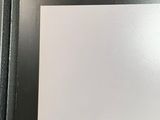 a picture of a black picture frame with a picture on it