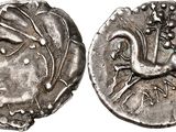 a close up of a coin with a bird on it