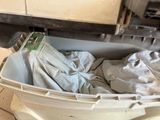 a trash can with a cloth in it on the floor
