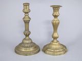 pair of antique brass candlesticks on a white background