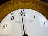 a close up of a clock with roman numerals on it