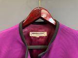 the back of a purple jacket hanging on a wooden hanger
