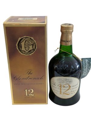 an image of a bottle of wine sitting next to a box