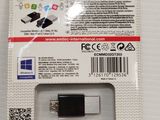 an image of a black usb drive in a package on a white surface