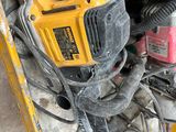 a yellow and black corded corded drill and a yellow and black corded corded drill and a yellow and black corded corded corded