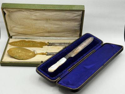 a box with a knife in it and a box with a spoon in it