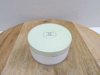 a white container sitting on top of a wooden table