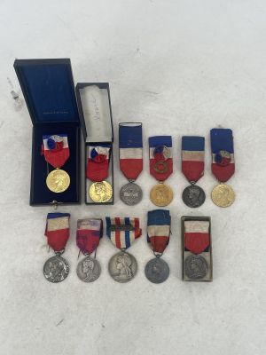 a lot of medals that are sitting on a table