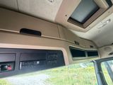 a view of the inside of a vehicle from the driver ' s seat