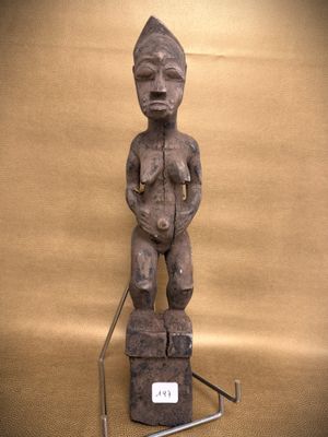 an image of a statue of a man standing on a block