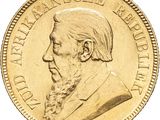 l'image d'une pièce d'or sur laquelle figure le visage d'un homme