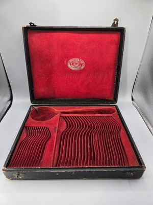 a red case with a set of silverware in it