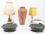 three lamps and a lamp shade on a table