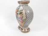 a vase that has a picture of a woman on it