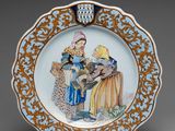 an image of a blue and gold plate with a woman and a child