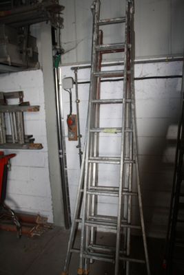 a ladder leaning up against a wall in a garage