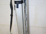 an image of a tripod and a tool bag in a garage