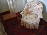 a chair that is sitting in the corner of a room