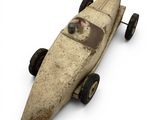a small toy car that is sitting on a white surface