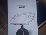 packaging for a wii game system sitting on top of a cardboard box