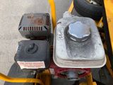 a small engine on the back of a yellow vehicle