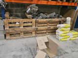 a pile of boxes sitting on the floor next to a pile of boxes