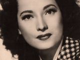 portrait of a black and white photo of a woman wearing a checkered coat