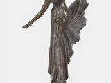 bronze statue of a woman holding a fan on a marble base