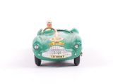 a green toy car with a man sitting in the driver ' s seat