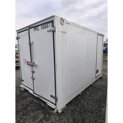 an image of a white container sitting in a parking lot