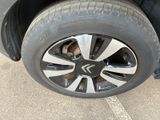 a close up of a tire on a car ' s rim