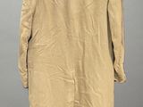 the back of a tan coat with a blue collar