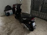 a scooter that is parked in a garage