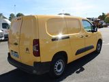a yellow van that is parked in a parking lot
