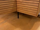 an image of a corner desk with drawers in a store