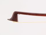 a close up of a bow on a white surface with a white background