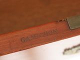a close up of a piece of wood with a name on it