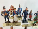 many figurines of men in military uniforms on display